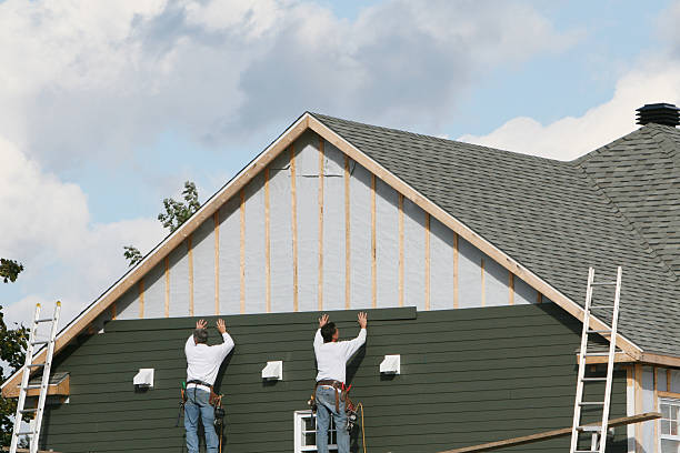Professional Emergency Siding Repair technician working in Butler, IN